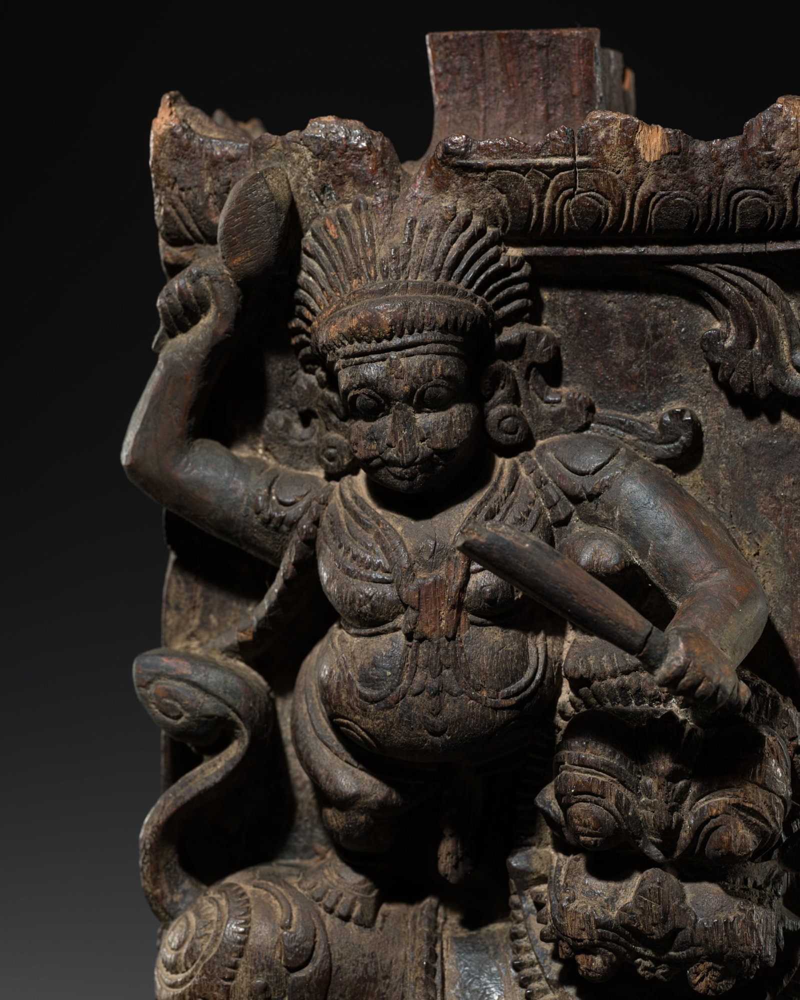 A WOODEN CHARIOT RELIEF PANEL DEPICTING A GUARDIAN DEITY ASTRIDE A LION, TAMIL NADU, 18TH -19TH: A WOODEN CHARIOT RELIEF PANEL DEPICTING A GUARDIAN DEITY ASTRIDE A LION, TAMIL NADU, 18TH -19TH CENTURY This lot is from a single owner collection and is therefore offered without reserve Southern Ind