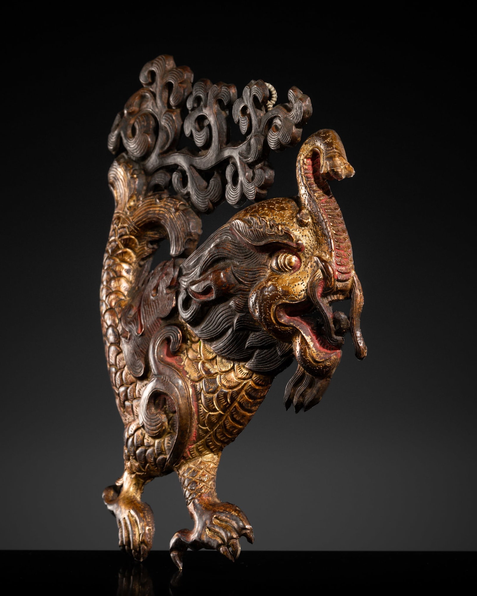 A RARE GILT REPOUSSÉ 'MAKARA' PLAQUE, TIBET, 18TH-19TH CENTURY: A RARE GILT REPOUSSÉ 'MAKARA' PLAQUE, TIBET, 18TH-19TH CENTURY This lot is from a single owner collection and is therefore offered without reserve Skillfully crafted, the mythical creature is dep