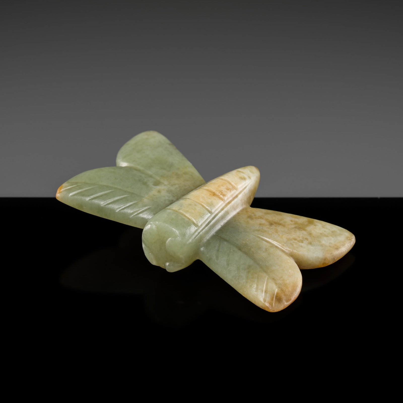 A PRISTINE AND EXCEEDINGLY RARE CELADON JADE 'BUTTERFLY' PENDANT, LATE NEOLITHIC PERIOD, HONGSHAN (1 of 17)