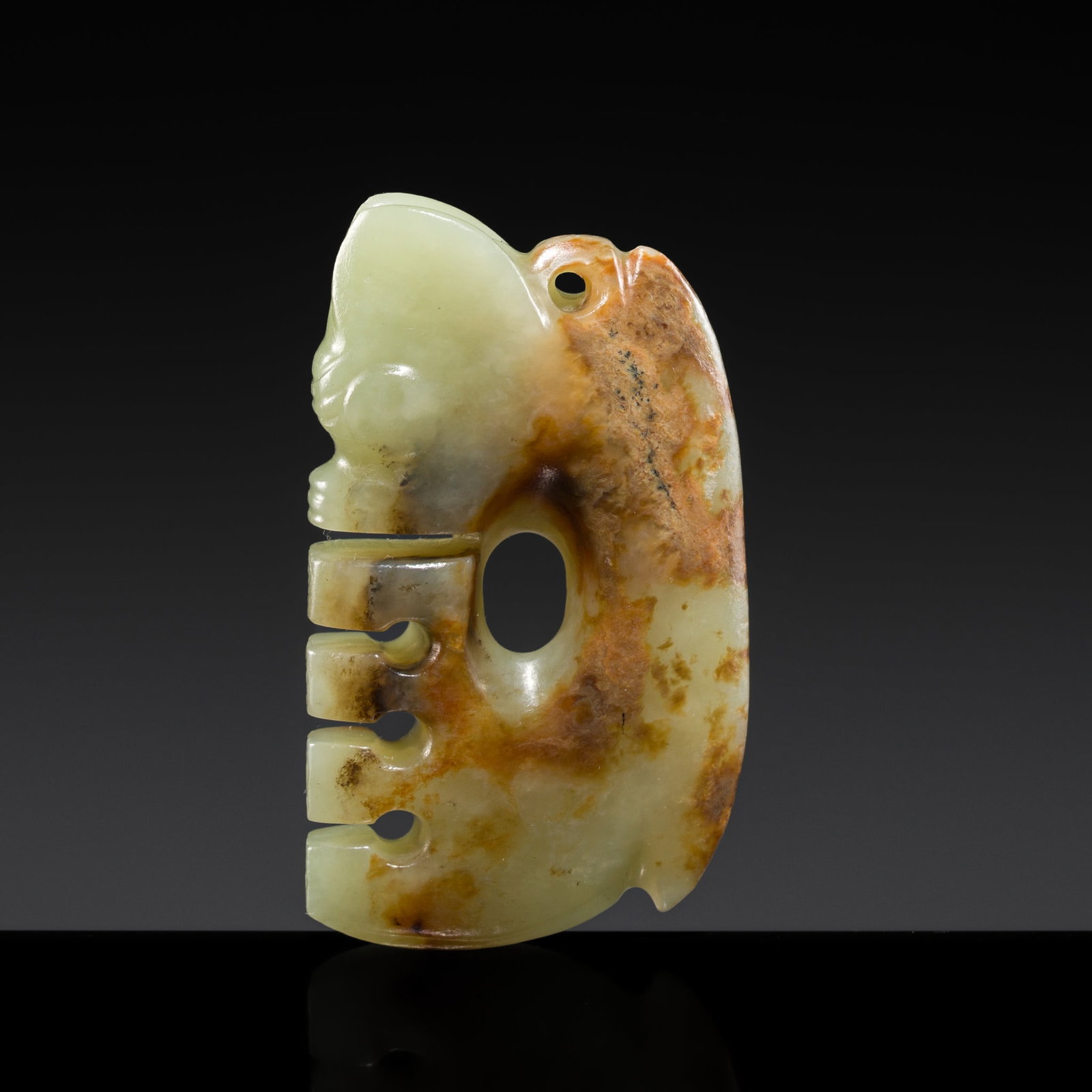 AN UNUSUAL CELADON AND RUSSET JADE 'PIG-DRAGON' PENDANT, ZHULONG, LATE NEOLITHIC PERIOD, HONGSHAN: † AN UNUSUAL CELADON AND RUSSET JADE 'PIG-DRAGON' PENDANT, ZHULONG, LATE NEOLITHIC PERIOD, HONGSHAN CULTURE Expert authentication: Dr. Gu Fang has examined the present lot and confirms its authe