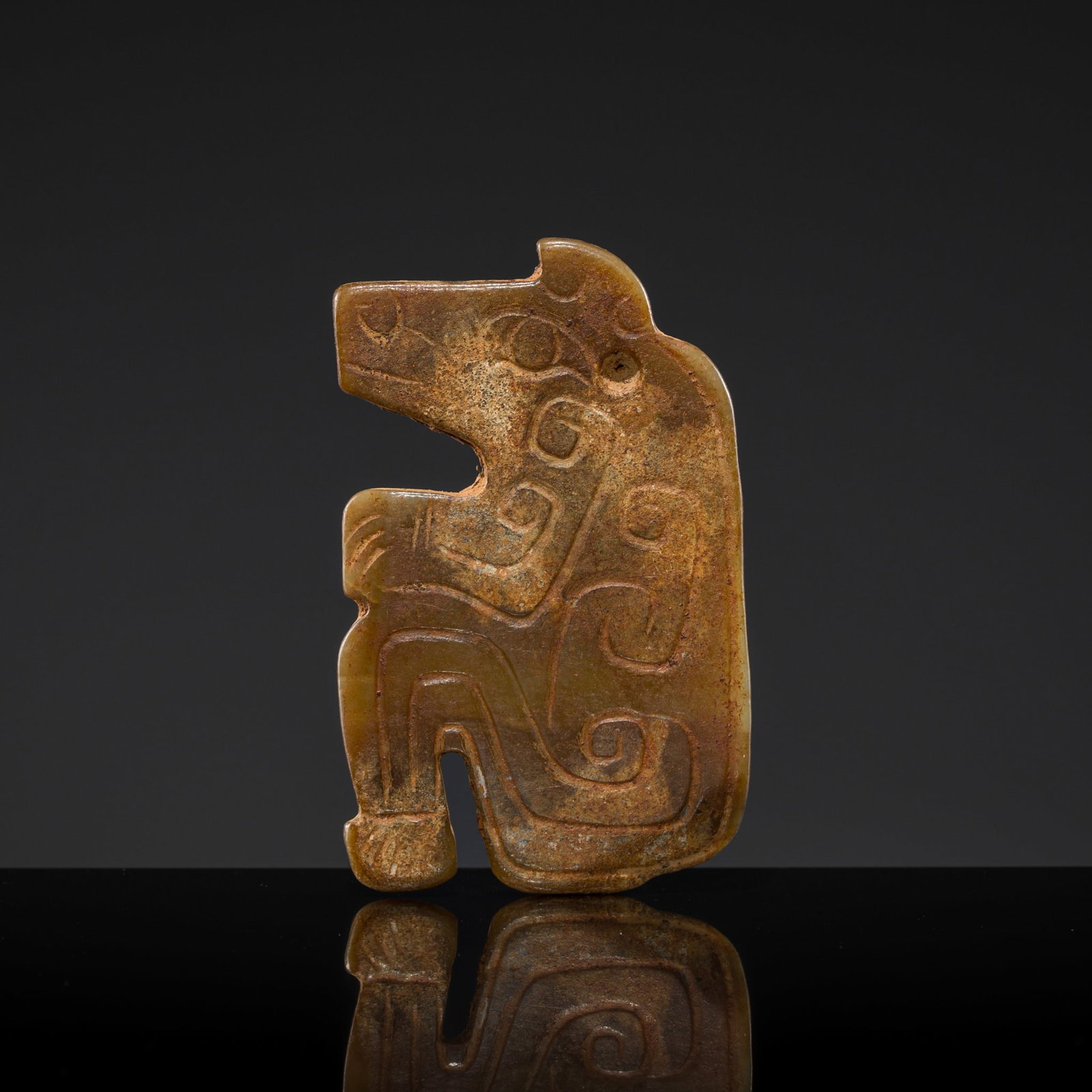A RARE JADE 'CROUCHING BEAR' PENDANT, LATE SHANG DYNASTY: † A RARE JADE 'CROUCHING BEAR' PENDANT, LATE SHANG DYNASTY Expert authentication: Dr. Gu Fang has examined the present lot and confirms its authenticity and the dating above, noting the style of