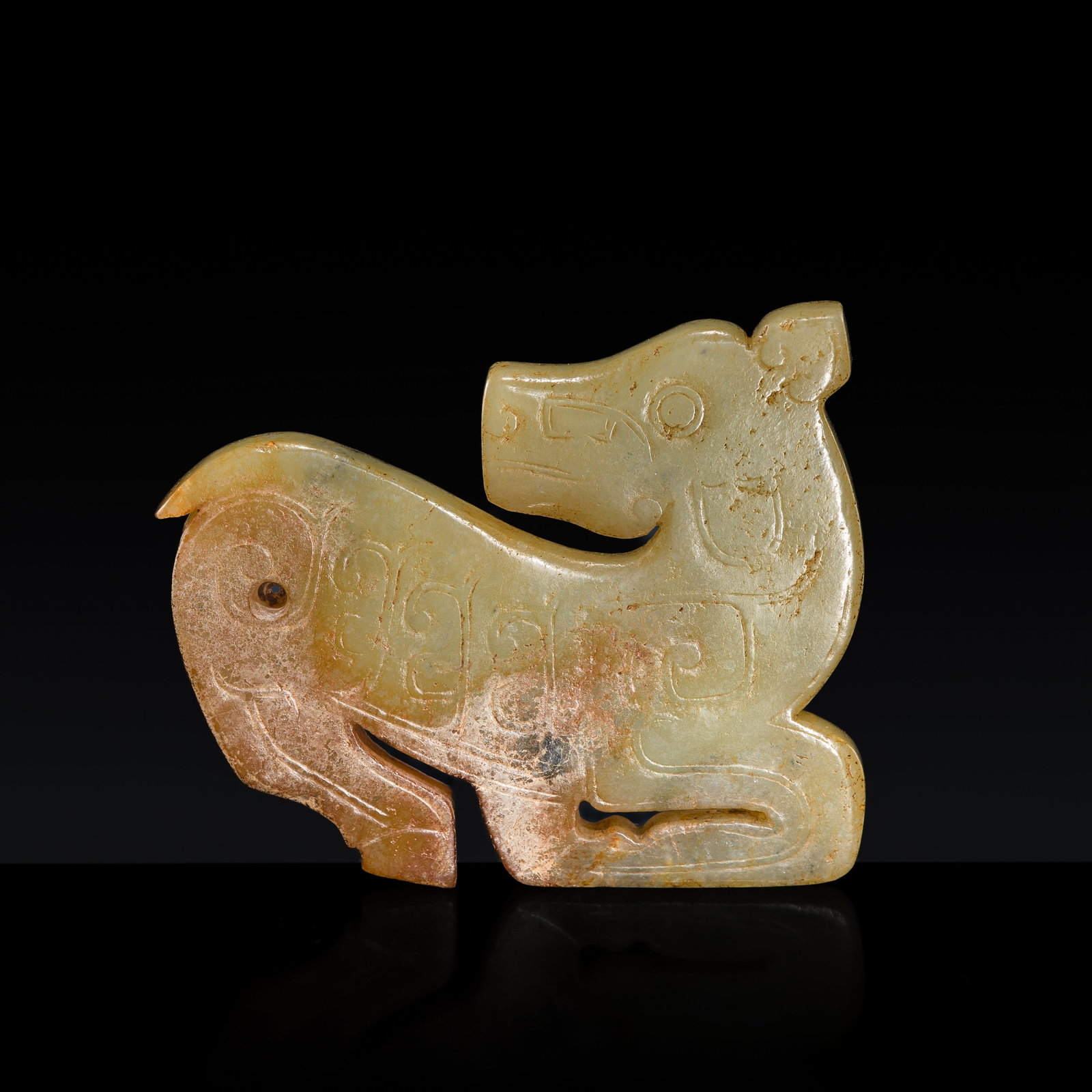 A YELLOWISH-GREEN AND RUSSET JADE 'DEER' PENDANT, WESTERN ZHOU DYNASTY (1 of 9)