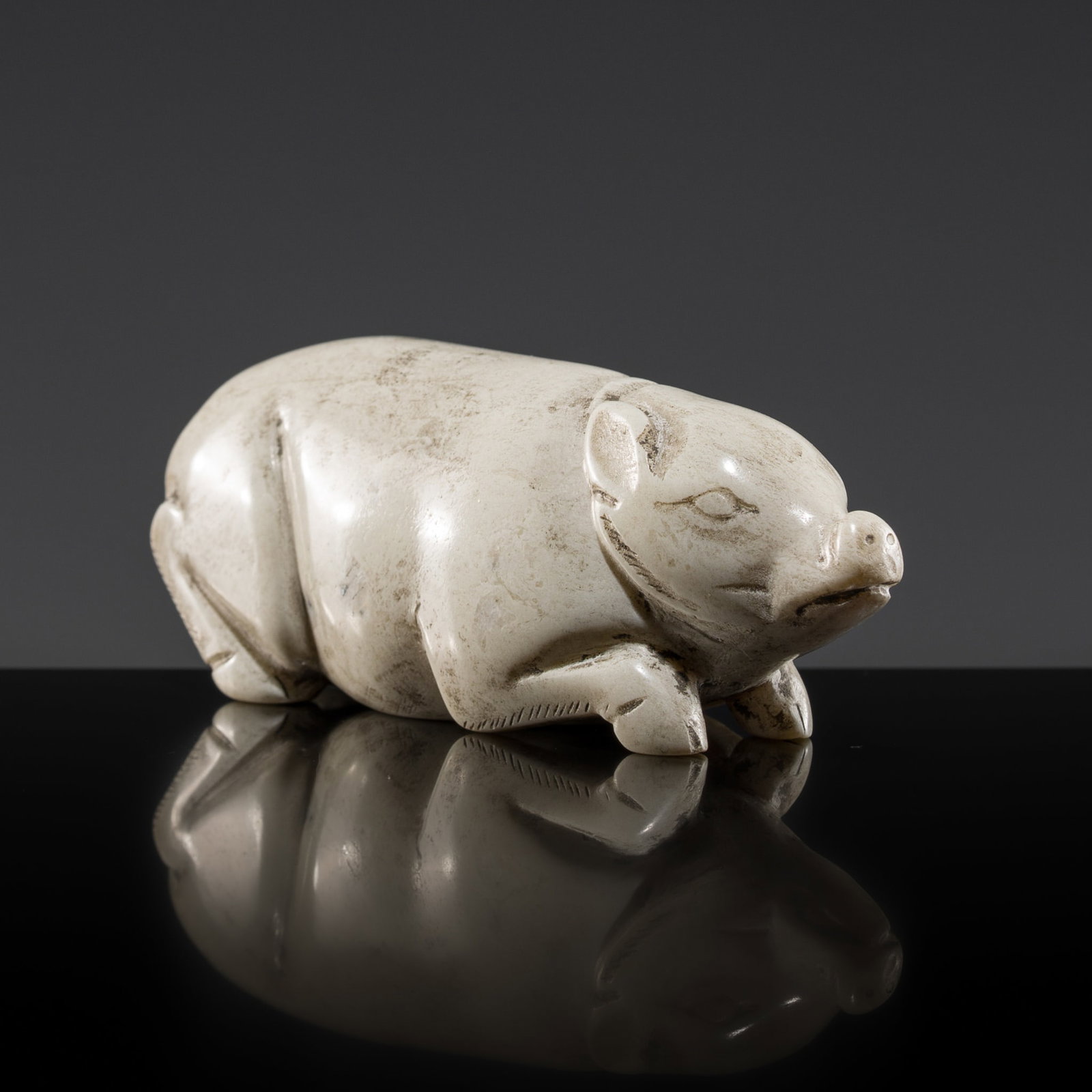 AN ALTERED JADE FIGURE OF A PIG, WESTERN HAN DYNASTY (1 of 13)