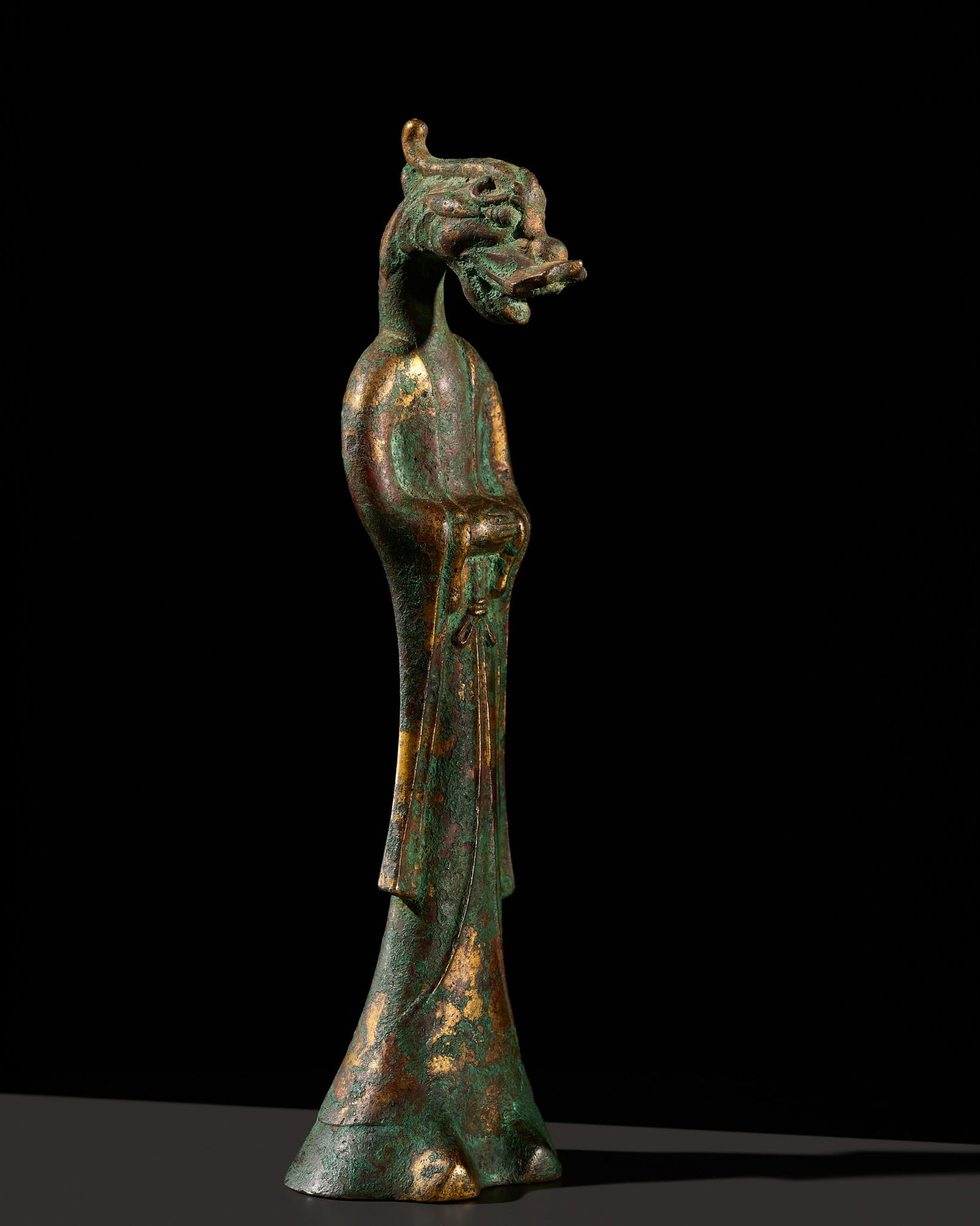 A RARE GILT-BRONZE ANTHROPOMORPHIC ZODIAC FIGURE OF A DRAGON, TANG DYNASTY: A RARE GILT-BRONZE ANTHROPOMORPHIC ZODIAC FIGURE OF A DRAGON, TANG DYNASTY Scientific Analysis Report: A report issued by CIRAM Science for Art Cultural Heritage on 31 August 2026, no. 0726-OA-1261J-1