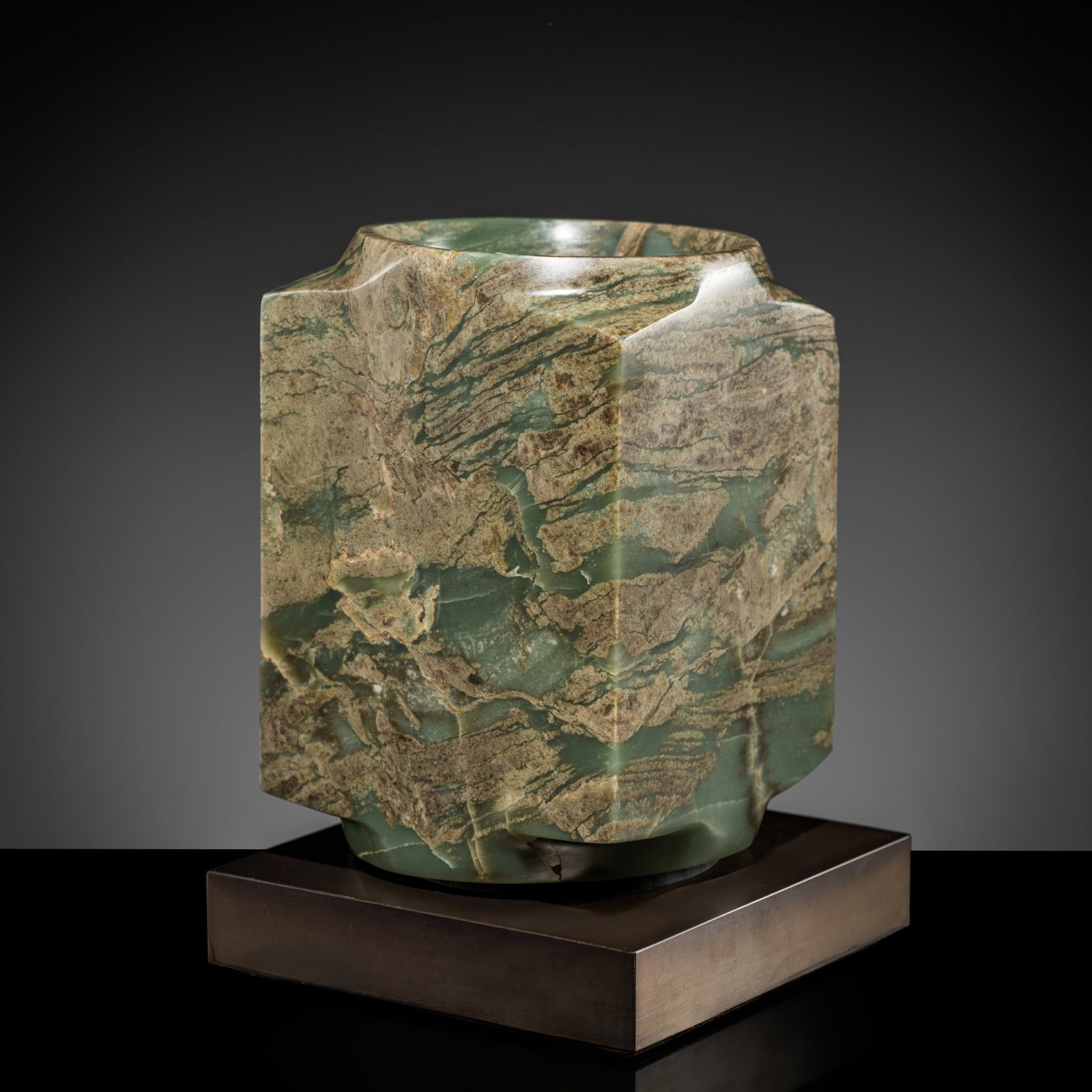 † A RARE AND MASSIVE MOTTLED GREEN JADE CONG, QIJIA CULTURE: † A RARE AND MASSIVE MOTTLED GREEN JADE CONG, QIJIA CULTURE Expert authentication: 1. Dr. Gu Fang has examined the present lot and guarantees its authenticity and the dating above. He assessed i