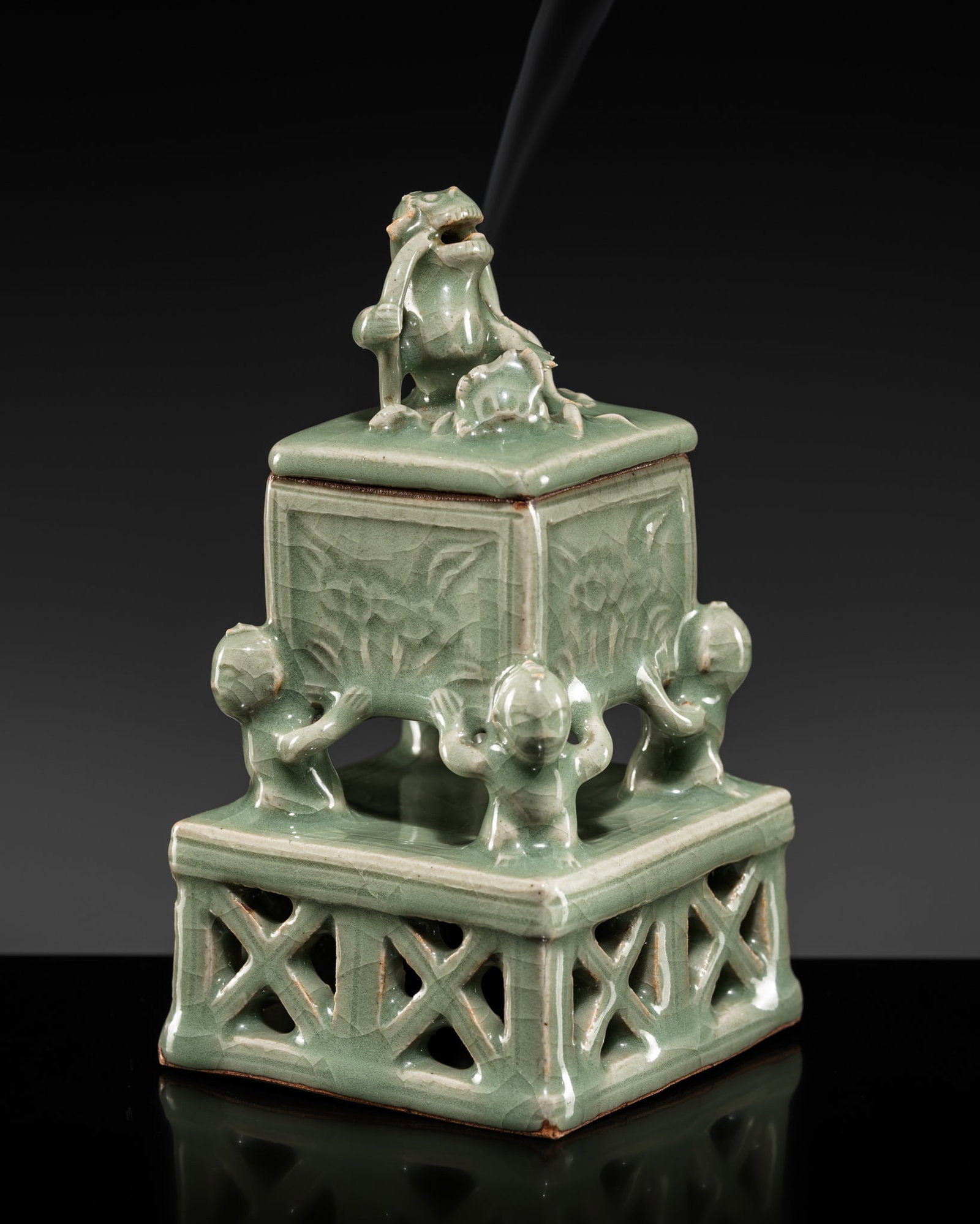 A RARE LONGQUAN CELADON 'FOUR BOYS AND A LION' CENSER AND COVER, MING DYNASTY: A RARE LONGQUAN CELADON 'FOUR BOYS AND A LION' CENSER AND COVER, MING DYNASTY Published: Feng-Chun Ma, A Thousand Years of a Hundred Boys in Chinese Art, Hong Kong, 2024, p. 86-87, no. 7. China, 15