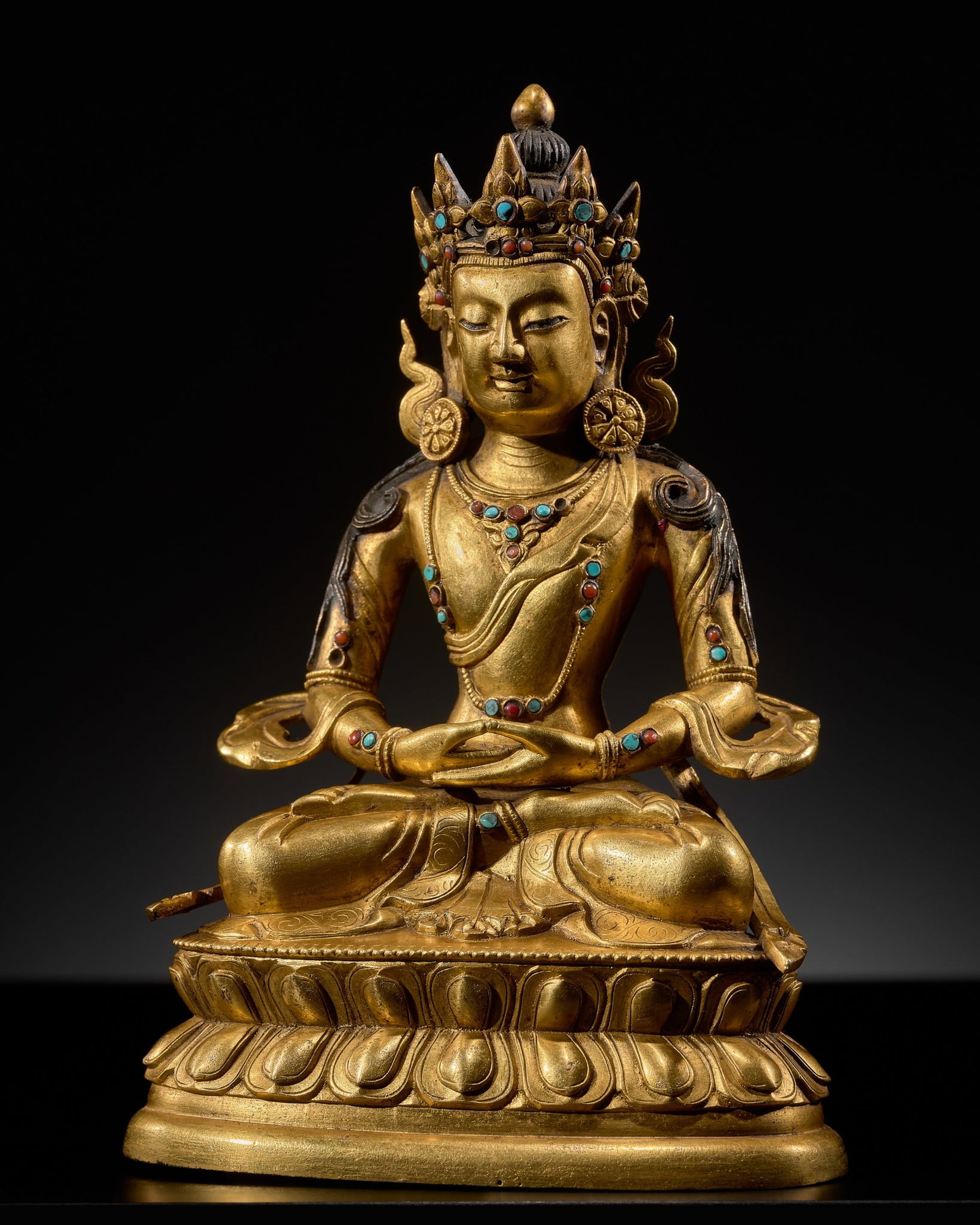 A GILT-BRONZE FIGURE OF AMITAYUS, TIBETAN-CHINESE, 18TH CENTURY: A GILT-BRONZE FIGURE OF AMITAYUS, TIBETAN-CHINESE, 18TH CENTURY Finely cast seated in vajraparyankasana atop a double-lotus base with the hands held in dhyana mudra, the face with serene expression fr