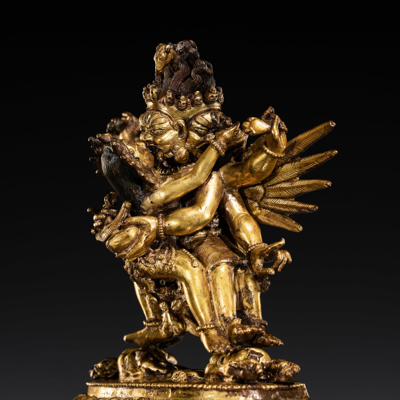 A GILT-BRONZE FIGURE OF THE 'SUPERSECRET' HAYAGRIVA WITH CONSORT, 18TH-19TH CENTURY: A GILT-BRONZE FIGURE OF THE 'SUPERSECRET' HAYAGRIVA WITH CONSORT, 18TH-19TH CENTURY Tibetan-Chinese. Finely cast in two parts. The winged, four-legged, six-armed wrathful deity is striding in alidhasa