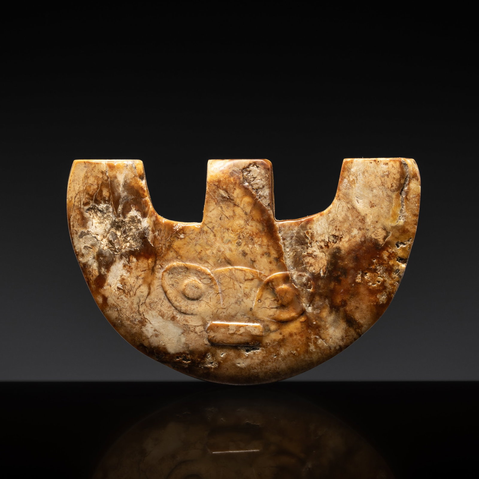 † A TRIDENT-FORM JADE 'MASK' ORNAMENT, LATE NEOLITHIC PERIOD, LIANGZHU CULTURE: † A TRIDENT-FORM JADE 'MASK' ORNAMENT, LATE NEOLITHIC PERIOD, LIANGZHU CULTURE Expert authentication: Dr. Gu Fang has examined the present lot and confirms its authenticity and the dating above,