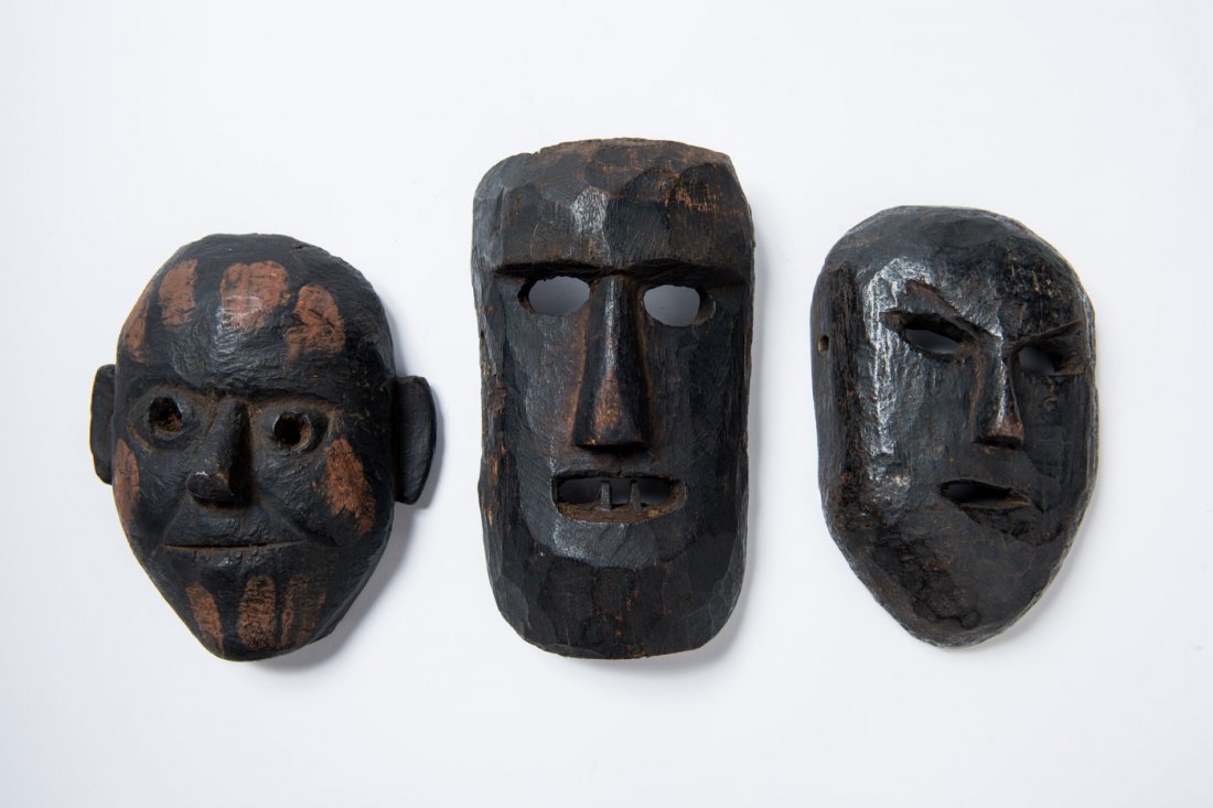 GROUP OF THREE MASKS: Wood, color. Asia, Nepal, 19th to 20th century HEIGHTS 18,4 Cm, 19,6 CM, 21,6 CM From the collection of a Tibetan in Austria The group including three masks, the smallest with a friendly expression, r