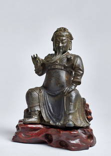 THE DEITY GUANDI: Bronze. China, Ming dynasty, approx. 17th cent. Guandi is China’s famous god of war, first awarded this position during the Ming dynasty. His characteristic features are his armour and long bla