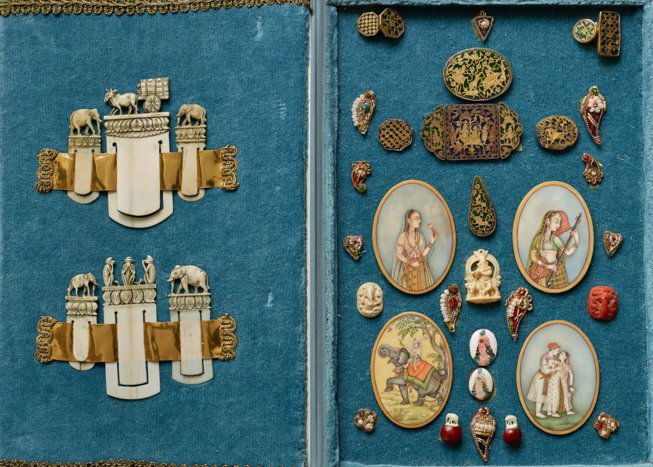 MINIATURE COLLECTIBLES IN CASE: Ivory, gold, painting, enamel, pearls, etc.. Mainly India, 19th cent. Truly charming collection of decorative objects, offered in a folding case; the collection including one group of four oval painti