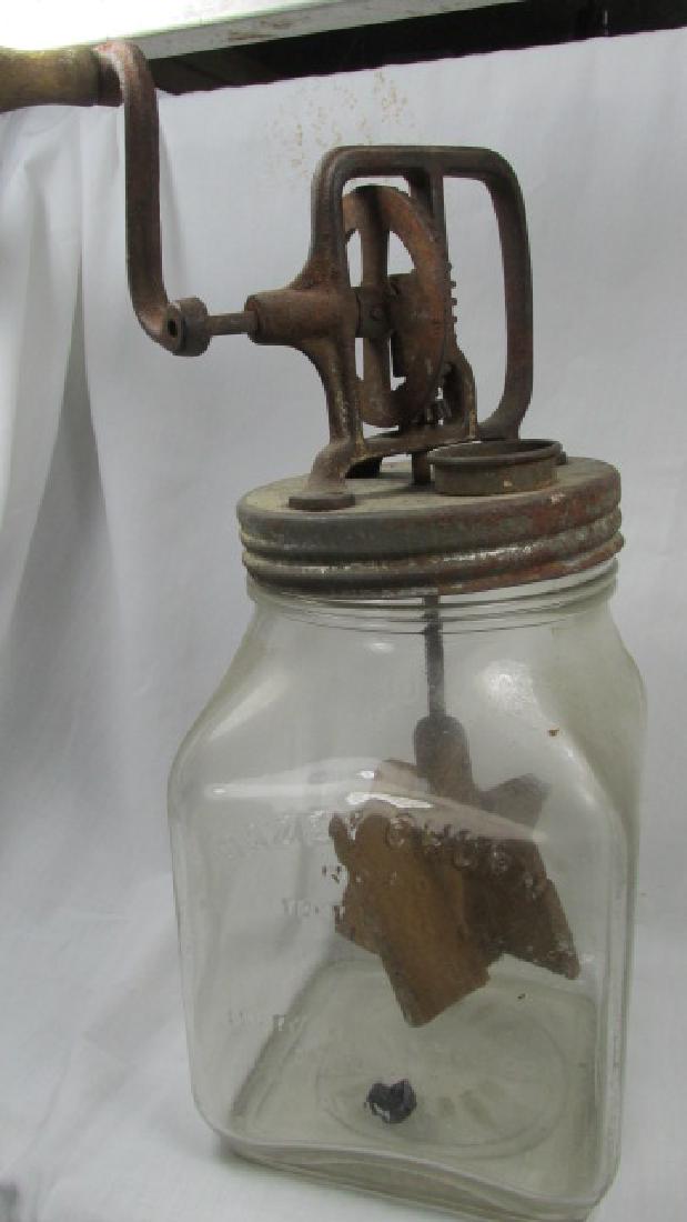 Dazey Churn No. 40: Probably 1 gallon size, metal lid with crank, wooden paddles, glass embossed with the Dazey Churn No. 40 St. Louis logo, 14" tall to the metal part, not the handle crank and 6" square on the base