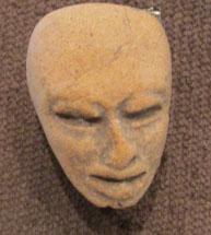 Pre-Columbian Clay Head Fragment: By 1958, the owner remembers this in the family home. From 500-1500 years old, likely Mexican, clay figure of a bald human, could be either a man or woman, all features intact, never had ears, oval sh