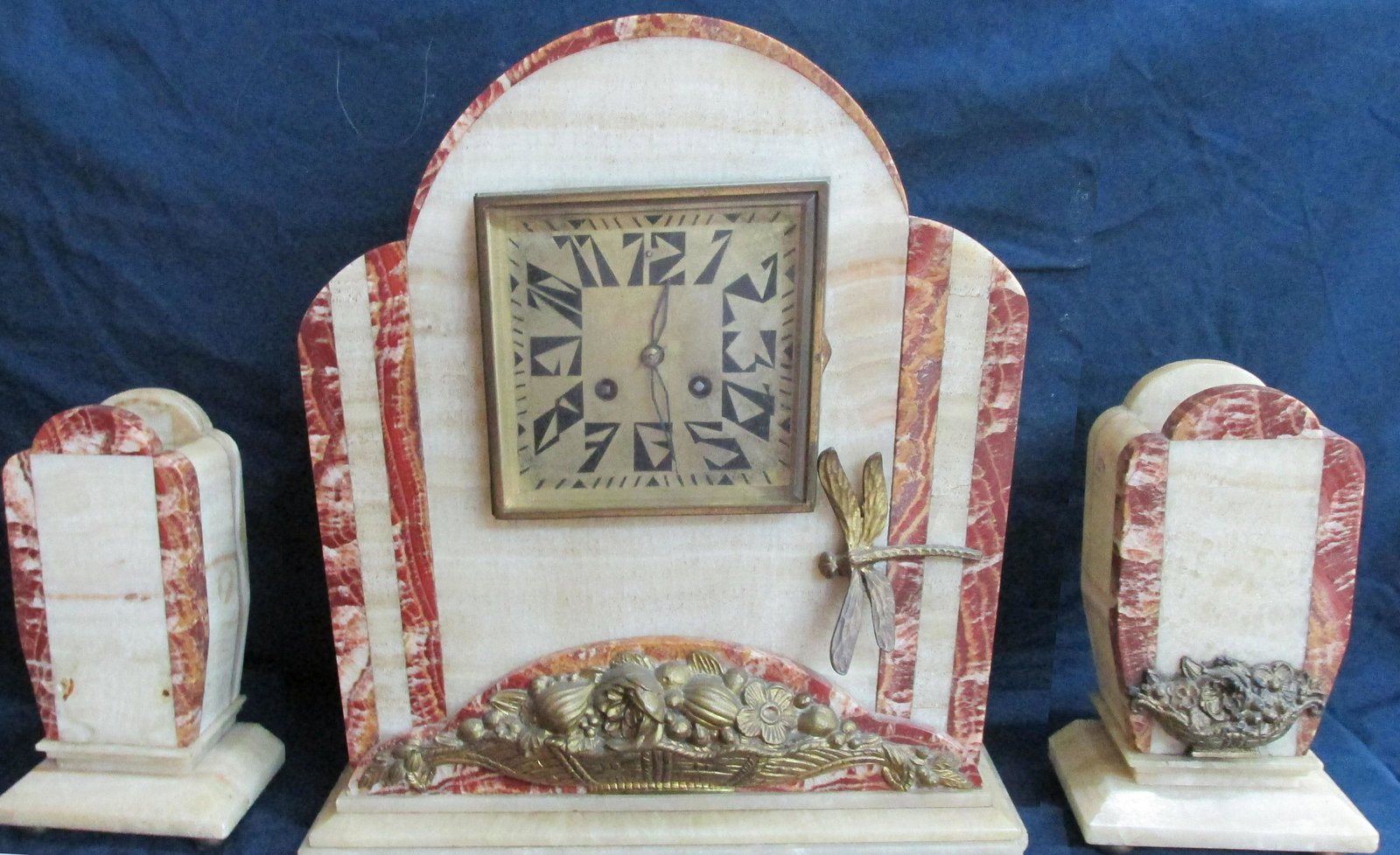 Reveyolis French Art Deco Clock Set: 2 Color French Marble w/bronze dragon fly, pure 1920s at the height of style, the side pieces are missing some floral baskets, stamped on the back is Reveyolis France. The clock face is pure deco, ver