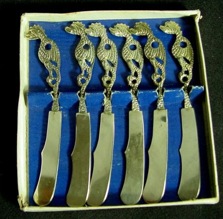 Silver Cocktail Knife Set, Gargoyle Handles: Boxed Set Of 6 Unmarked Silver Knives, Stamped Italy. The Handles Are An Unusual Full Bodied Gargoyle. Stored In The Original Paper Box, The Knives 5 3/8" Long. Very Good Condition. Likely to be 1950s