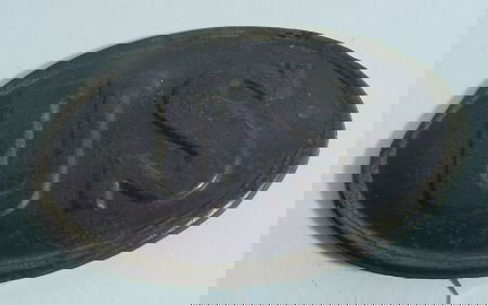 Civil War Oval Brass Plate From US Cartridge Box: Civil War Battlefield Pickup U.S. Oval Shaped Brass, Back Lead Filled, Plate From A Cartridge Box. 3 3/8" Long, 2 1/4" Wide Oval With 2 Pins At Each End For Securing, Only Pin Tips Remain. Probably Fo