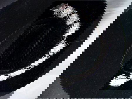 Siam Sterling Bracelet: Siam Sterling 1950s bracelet, unusual white enamel with silver figures of gods and goddesses flying in the air. 2 sections have missing silver circles that are easily obtained, 7"long, good working or