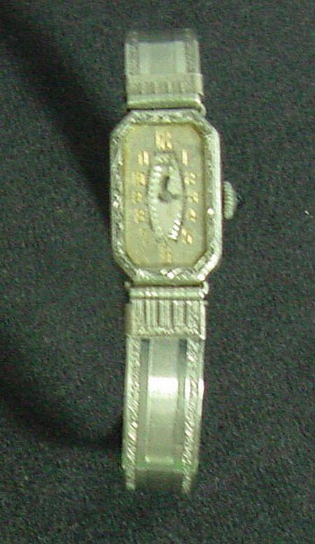 Art Deco Ladies Hoverers Wristwatch: Pure Art Deco styling, Hoverers, original band with Game? Stamped inside, likely to be from 1920s, not running condition. This was made to look like a bracelet and could be work as a piece of normal j