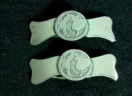 Pr. Silver Pins: Marked Sterling with probable hair use, dancing couple in center medallion, 2" long by 3/4" wide. Probably 1950s era.