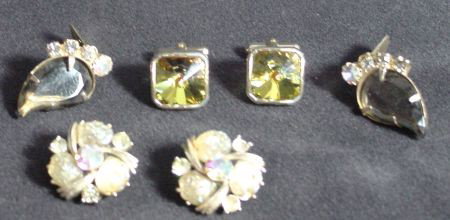 3 Pr. Retro Gold Earrings, Cuff Links: Liner clip back iridescent stone earrings, dark topaz colored clip back tear drop shaped earrings and large square iridescent cuff links, all retro, all from the 1950s. All in good wearable condition.