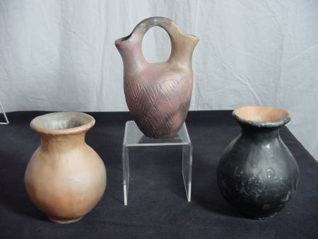 Cherokee Indian Pottery by Don Swimmer: Pair of unsigned vases standing some 5 3/4" tall by 4 1/2" wide, brown and black colors, you can even feel the carving and knife marks on the outer surfaces, old repaired nicks before firing that add 
