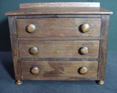 Miniature Mahogany 3 Drawer Chest: Circa 1900-1920, Mahogany and Pine secondary woods, likely used as a jewel cabinet as it now has felt inside the drawers, button knobs and feet, old if not original finish, 7 3/4" tall to the top of t
