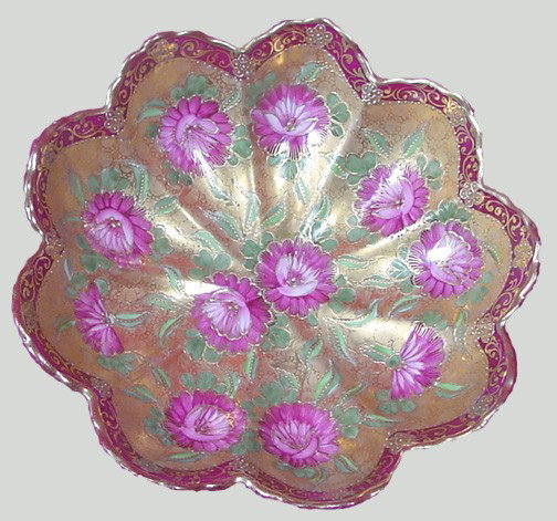 A Hand Painted Oriental Gold Trimmed Center Bowl: Circa 1910-20, heavy gold acid textured center with hand enameled flowers, oriental marking on back, 9 3/4" wide by 2 3/4" tall, probably a piece of early Nippon, excellent condition.