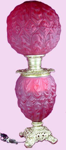 An Imperial Red Satin Glass Gone With The Wind Lam: Red Satin, everyone's favorite, from a well known Philadelphia glass collector, likely to be Imperial Red Satin Glass by Consolidated Lamp & Glass, Coraopolis, Pa. The metal work has been painted year