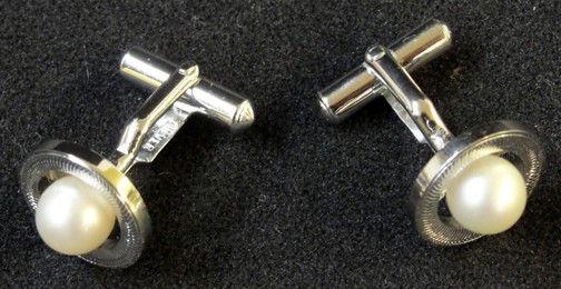 A Pr. Pearl & Silver Cuff Links: Marked silver, likely to be 1950s or 60s, circles of silver around the pearls that have lots of luster, slightly larger than 1/2" diameter, belonging to Mr. White of The Wellesley Inn on the Square in