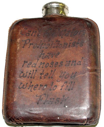 A World War II Era Leather Covered Flask: Leather covered glass half pint flask, openings in the leather show levels of alcohol available, One Drink, Two Drinks, Half Full, Damn Fool, Empty, From Denver, Colorado, back side with poem, Can't F