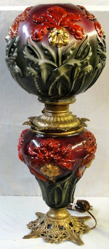 A Regal Iris Pittsburgh Lamp Gone With The Wind La: Raised floral design with green leaves, gold and red flowers that have likely been repainted. The font is signed Miller and the lamp has been electrified. The overall height of the lamp is 25" without