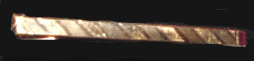 A 14K Gentleman's Tie Bar: Seemingly pinkish/red and yellow gold with a diagonal mirror and textured band on this 1 7/8" long by 1/8" wide, 14K German made tie bar. Worn by Mr. White of The Wellesley Inn On The Square in Welles