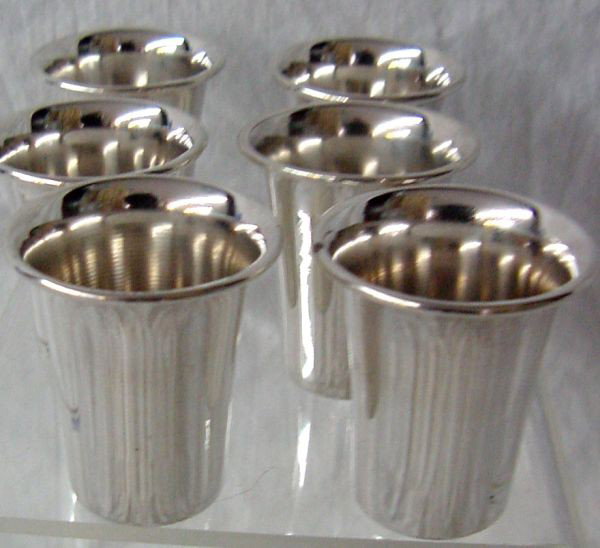 A Set of 6 Sterling Silver Shot Glasses: Probably 1950s era, marked ESCO Sterling, set of 6 with gently flared lips, about 1 1/2" tall and wide.