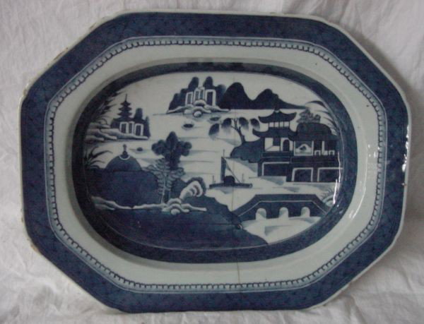 A Large Blue Canton Open Bowl: Someone years ago loved this bowl enough to have it repaired with staples, several rim nicks, 13 3/4" long by 11" wide by 2 1/4" tall. Easily mid 19th century, the bowl could and certainly has been us