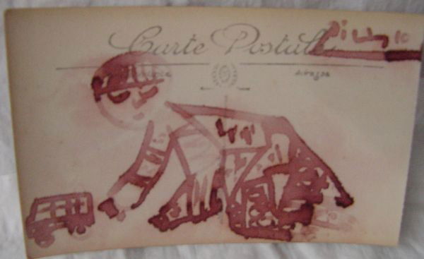 A Pablo Picasso Felt Tip Drawing: Drawn on a French post card measuring some 5 1/2" wide by 3 1/4" tall, a child abstract figure is shown on hands and knees playing with a toy truck or wagon. Signed lower right Picasso, red marker on