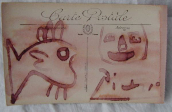 A Pablo Picasso Felt Tip Drawing: Drawn on a French post card measuring some 5 1/2" long by 3 1/4" tall, a human abstract face on one half and probably an abstract fish on the other half, signed Picasso lower right. Red marker on pape