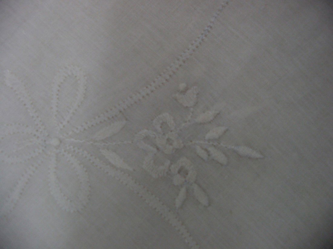 A 1930s Elegant Tablecloth & Napkins: 52 by 50", beautiful bouquets of hand embroidered flowers with garlands and elegant details, all linen, 8 matching napkins 8 1/2" by 9", probably 1930s or forties and a really pretty edge of handwork