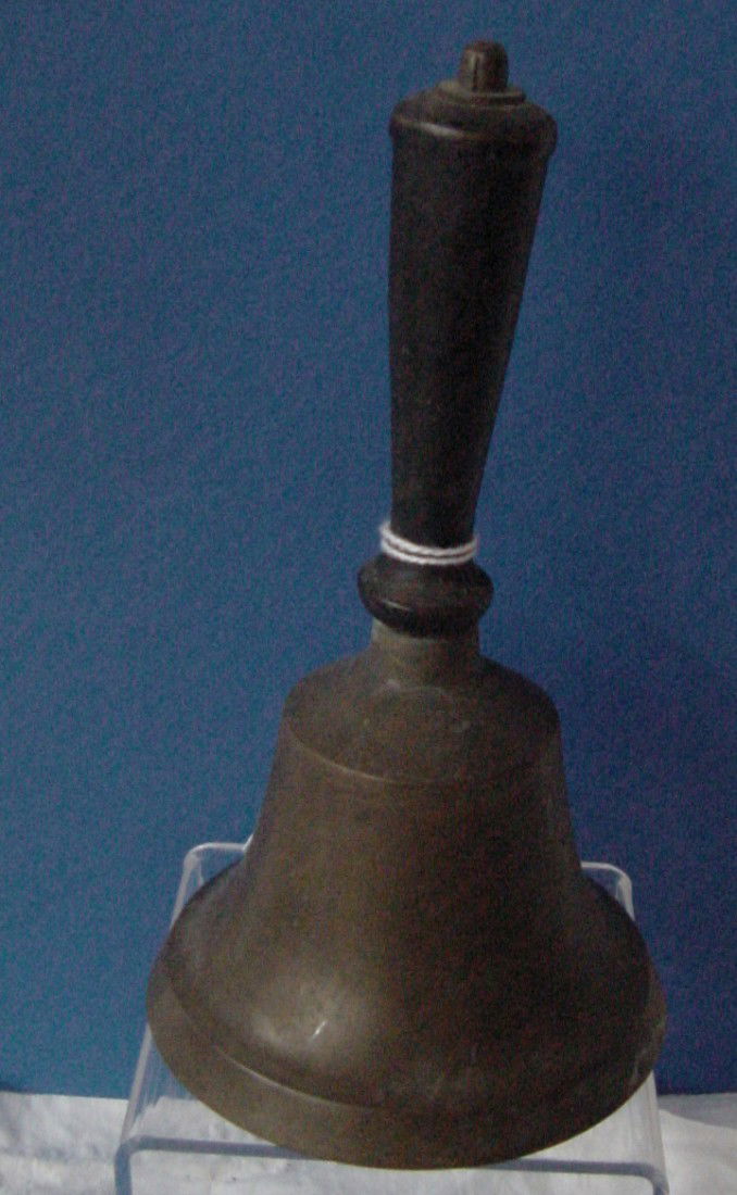 A Brass 19th Cent. School Bell: Wooden handle, great tones, tight handle, 7 1/2" tall by 4" wide. 1870-1900 era.