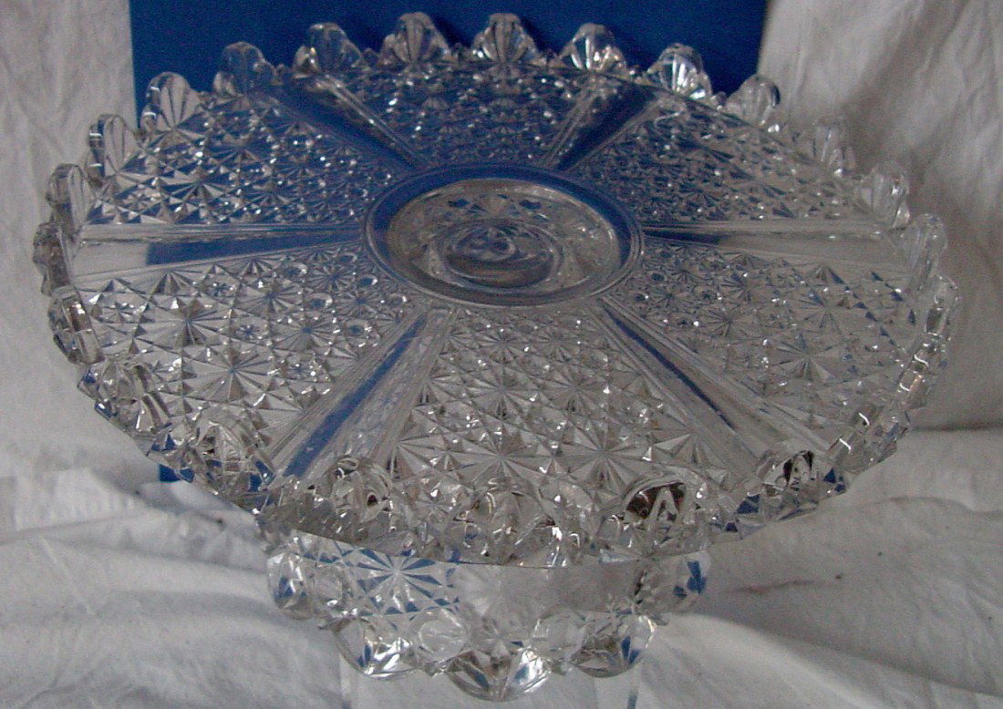 A Fancy Pressed Glass Cake Stand: Any cake you would put on this would look good, this will hold close to a 10" cake, 5 1/2" tall, excellent condition. Circa 1880-1900.