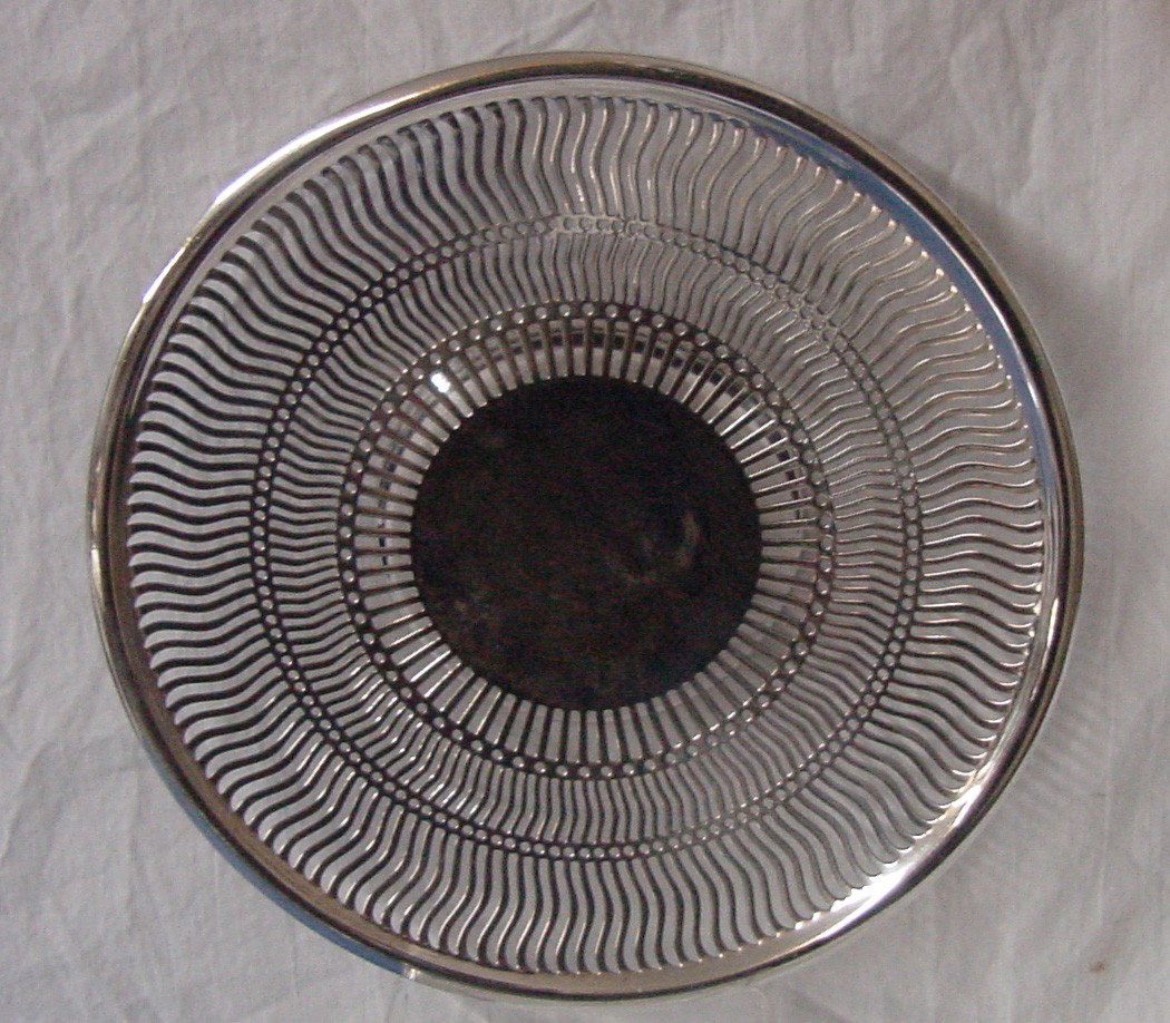 A Sheffield Nickel Silver Cake Stand: Open pierced sides, 9 1/2" diameter, marked Sheffield Nickel silver, this is a really pretty stand for cake, cookies, any type of pastry you could want. Probably 1940s or 50s era.