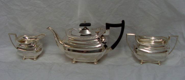 British Sterling Tea Set Art Deco 1921: Sterling Sheffield 1921 marking, this Art Deco tea set is in mint condition, gadroon edge, Deco era handles, round button feet, signed W & H for Walker & Hall of Sheffield, the teapot is stamped 5 hal