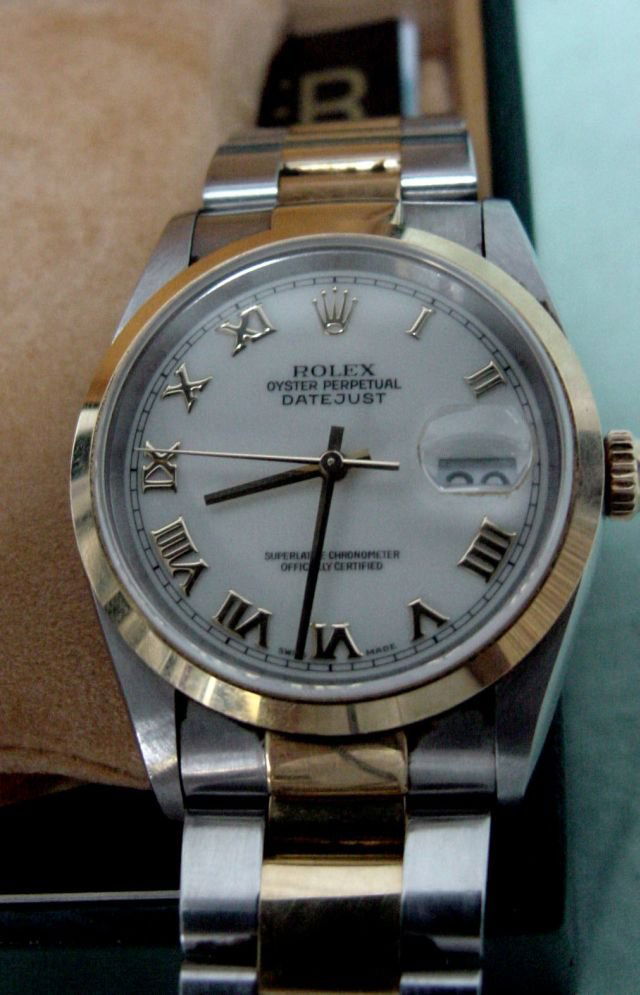 Rolex Oyster Perpetual Date: Men's wrist watch, original box, all paperwork with this, Style No. R16203353B7836 and Serial Number U14471, Dial White Roman Bold, this Rolex DateJust seems to be in mint condition and ready to wear,