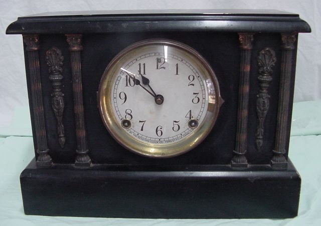 Sessions Mantle Clock: Time & strike, curved glass face cover, side fluted columns on both ends with black finish to the case, Sessions Clocks of Forestville, Conn., probably 1910-30, unknown if the clock runs but it likely