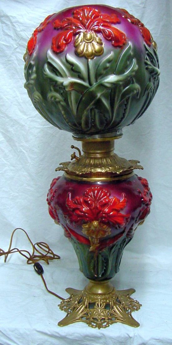 Regal Iris Pittsburgh Lamp Gone With The Wind Lamp: Raised floral design with green leaves, gold and red flowers that have likely been repainted. The font is signed Miller and the lamp has been electrified. The overall height of the lamp is 25" without