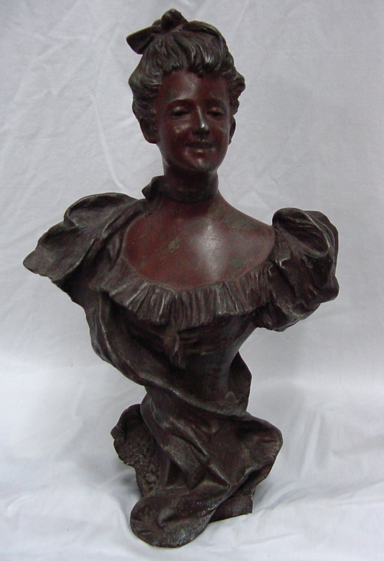 P. Miro Faux Bronze Art Nouveau Bust: Attractive maybe Gibson Girl style lady with puffed sleeves and upswept hair, signed on the back P. Miro?, either white or Speltzer metal plated with minor signs of wear showing in this 100 year old p