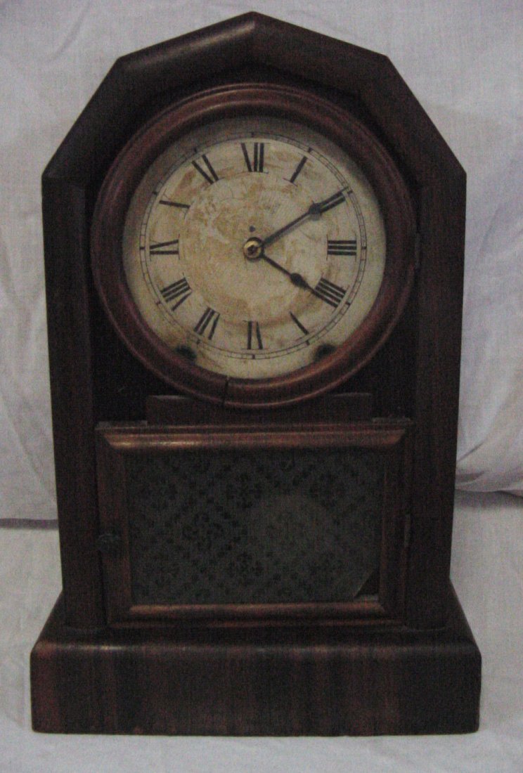 Gem New Haven Mahogany Mantle Clock: Probably 1870-1890 era, original label intact still inside the back stating Gem and Day Striking from New Haven Clock Co., minor veneer losses to the veneer surface on the front and sides, one piece o