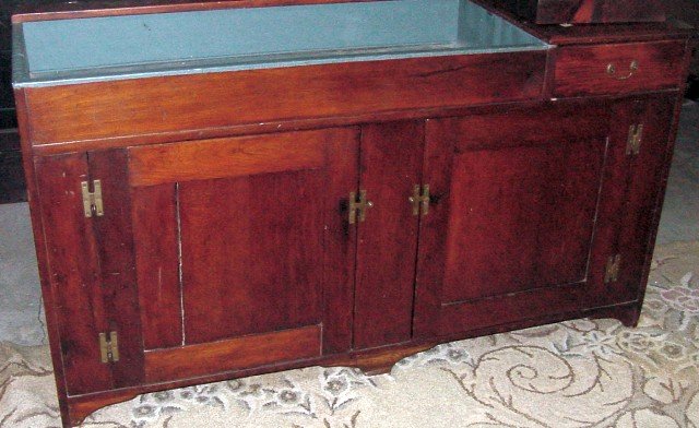 Poplar 19th Cent. Dry Sink New England: Old refinished Poplar surface now resembling Walnut, probably refinished 60-70 years ago and now very mellow, painted metal sink area, divided drawer interior, solid ends, replaced H hinges, 5 feet lo