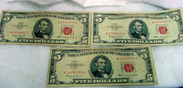 3 Red Seal $5 United States Notes: 3 bills, all $5 with red seals from Washington D. C., signed C. Douglas Dillon, United States Notes, all 1963.