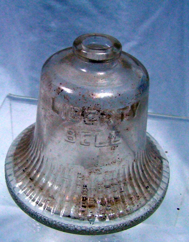 Stough's Bell Toy Candy Container: Circa 1944, # 96 on page 45 in the Toy Candy Container book by Poirer & Dezso, 2 1/4" high by 2 7/16" wide, vertical ribs around lower third of bell, marked on front and back Liberty Bell with simulat